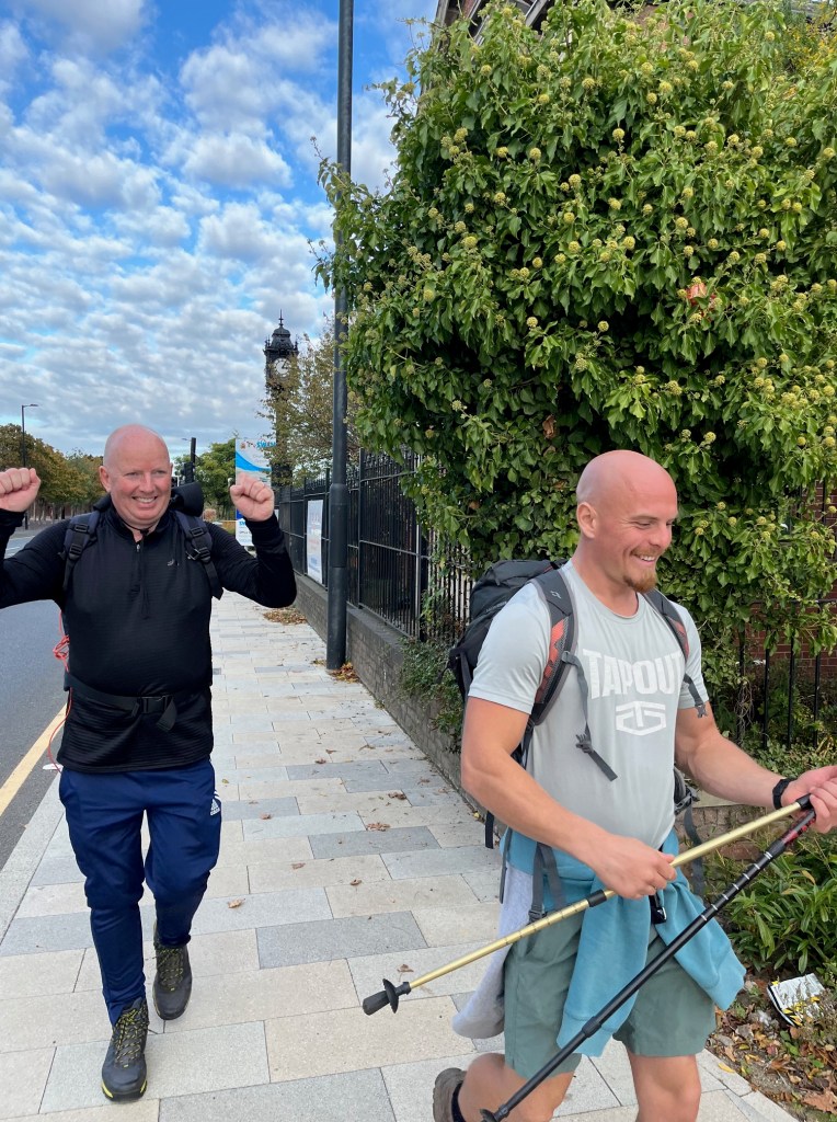 Julian arms aloft and a smiling Ben, arrive at Segedunum Fort.